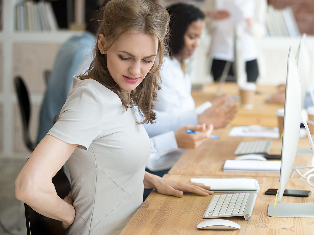 Image of a woman at her desk