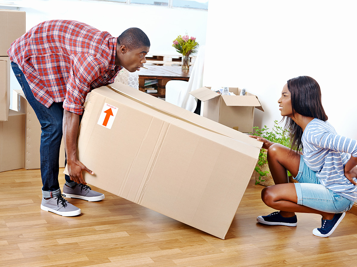 Image of people lifting a box in pain